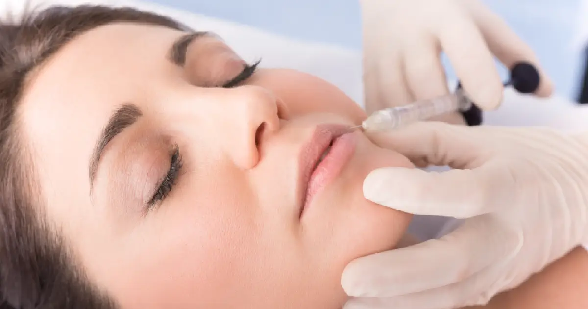 A woman getting a lip filler in Waterloo